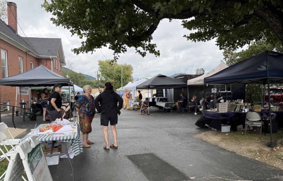Vendors and visitors gather at the Swannanoa Market, part of the Swannanoa Resilience Hub’s efforts to support local businesses and bring the community together nearly two years after Tropical Storm Helene.