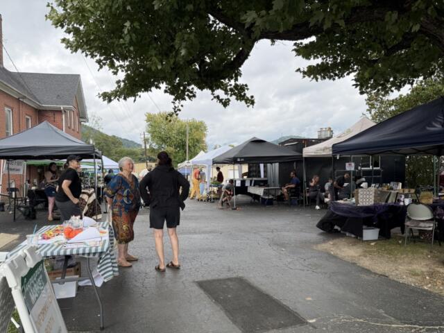 Vendors and visitors gather at the Swannanoa Market, part of the Swannanoa Resilience Hub’s efforts to support local businesses and bring the community together nearly two years after Tropical Storm Helene.