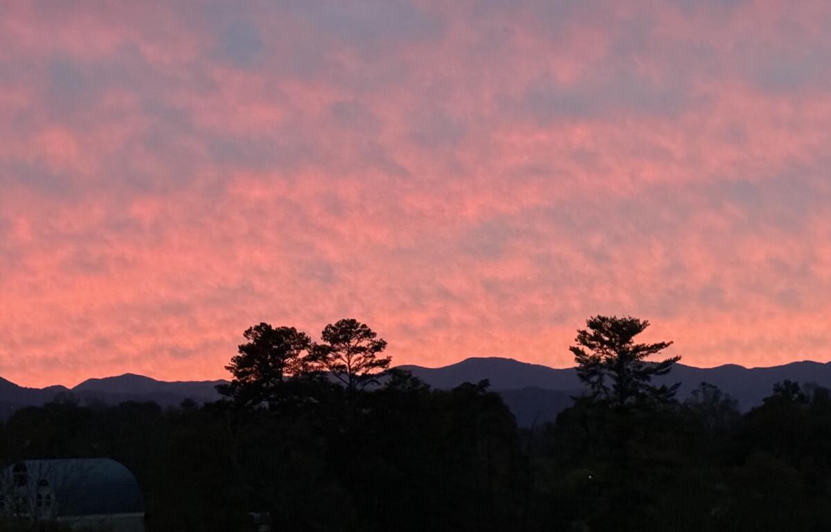 Friday evening's colorful sunset over the mountains offered a beautiful end to the day, but cloudy skies, heavy rain and gusty winds are expected across Western North Carolina this weekend as Isaias moves north.