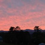 Friday evening's colorful sunset over the mountains offered a beautiful end to the day, but cloudy skies, heavy rain and gusty winds are expected across Western North Carolina this weekend as Isaias moves north.