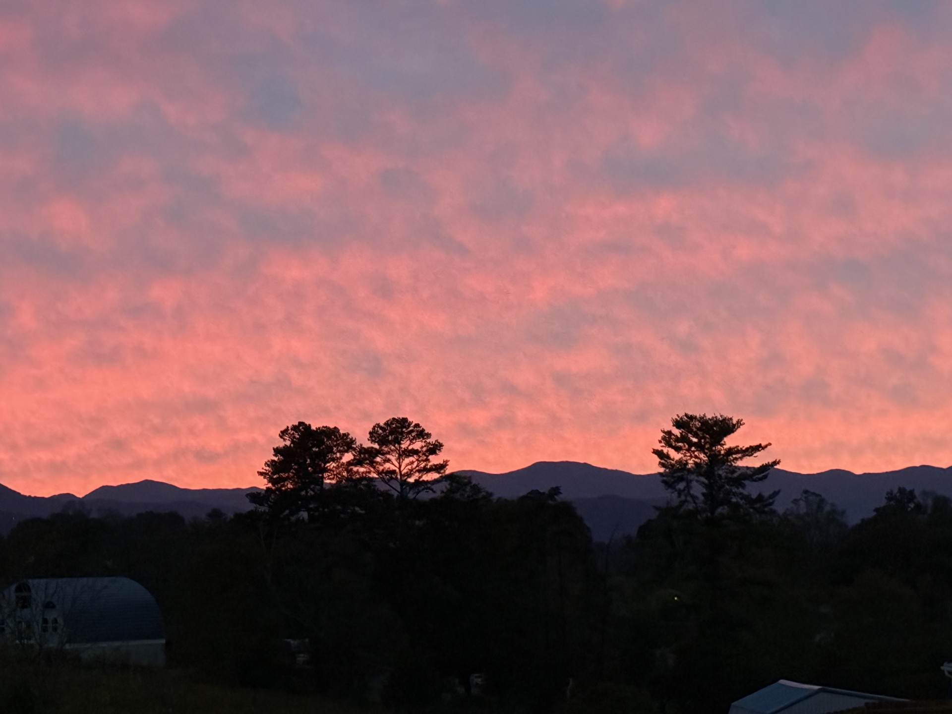Friday evening's colorful sunset over the mountains offered a beautiful end to the day, but cloudy skies, heavy rain and gusty winds are expected across Western North Carolina this weekend as Isaias moves north.