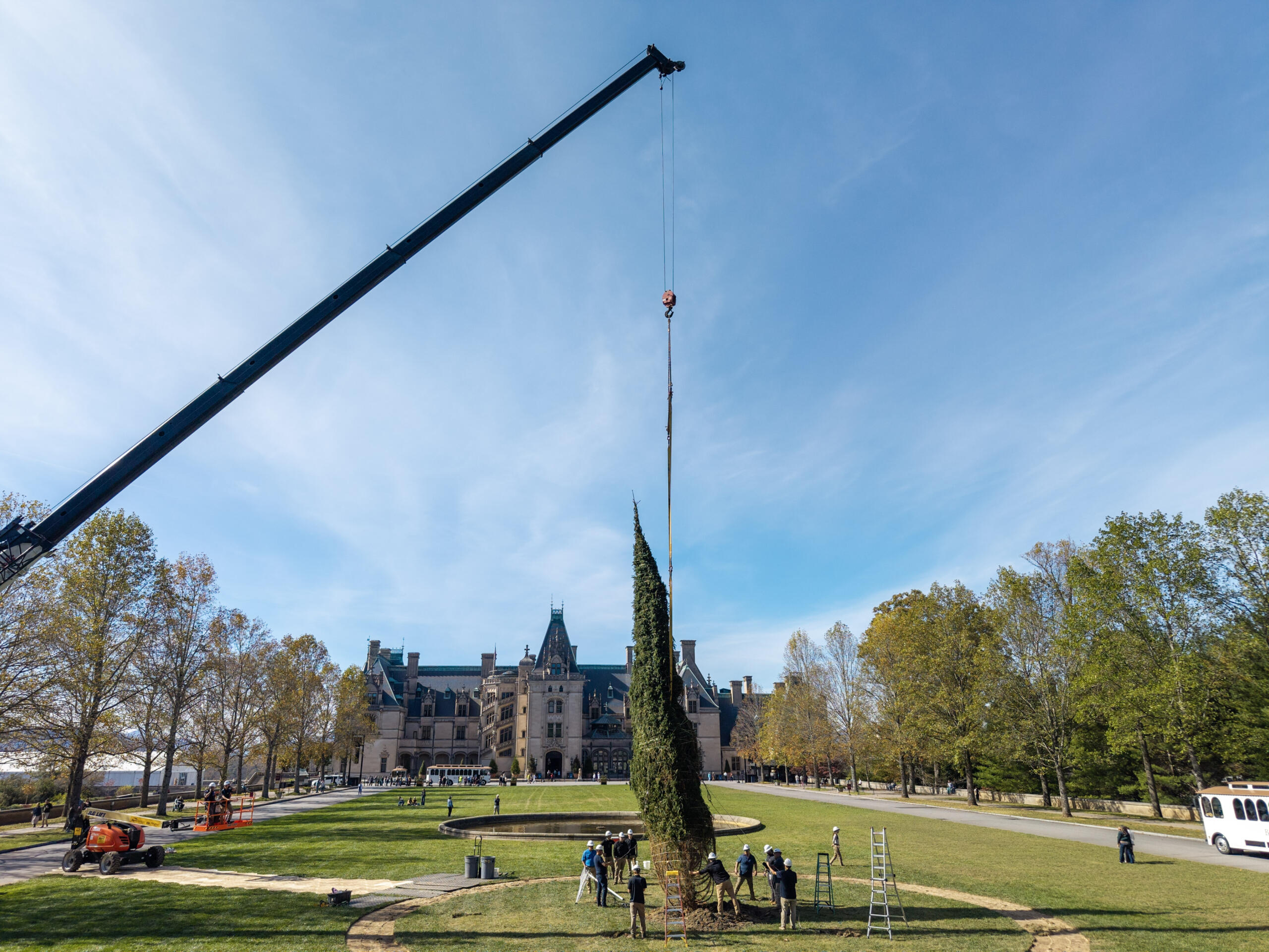 Crews work to install new trees on the front lawn of the Biltmore Estate on Oct. 26.
