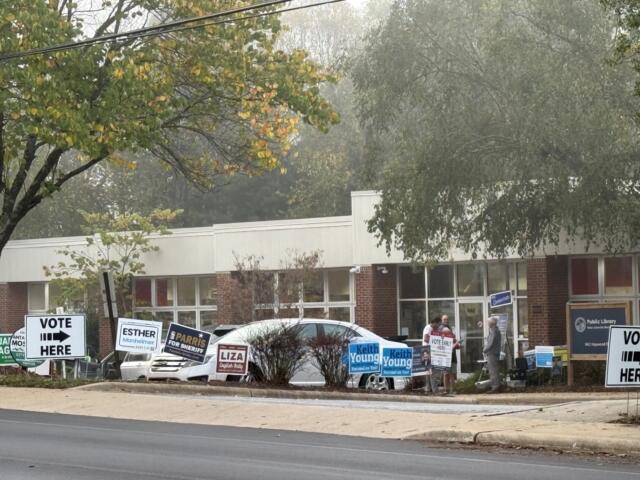 Campaign signs line the entrance to West Asheville Branch Library, one of Buncombe County's 13 early voting locations. More than 7,000 people cast ballots across the county Thursday, Oct. 15, the first day of early voting for the Nov. 3 general election.