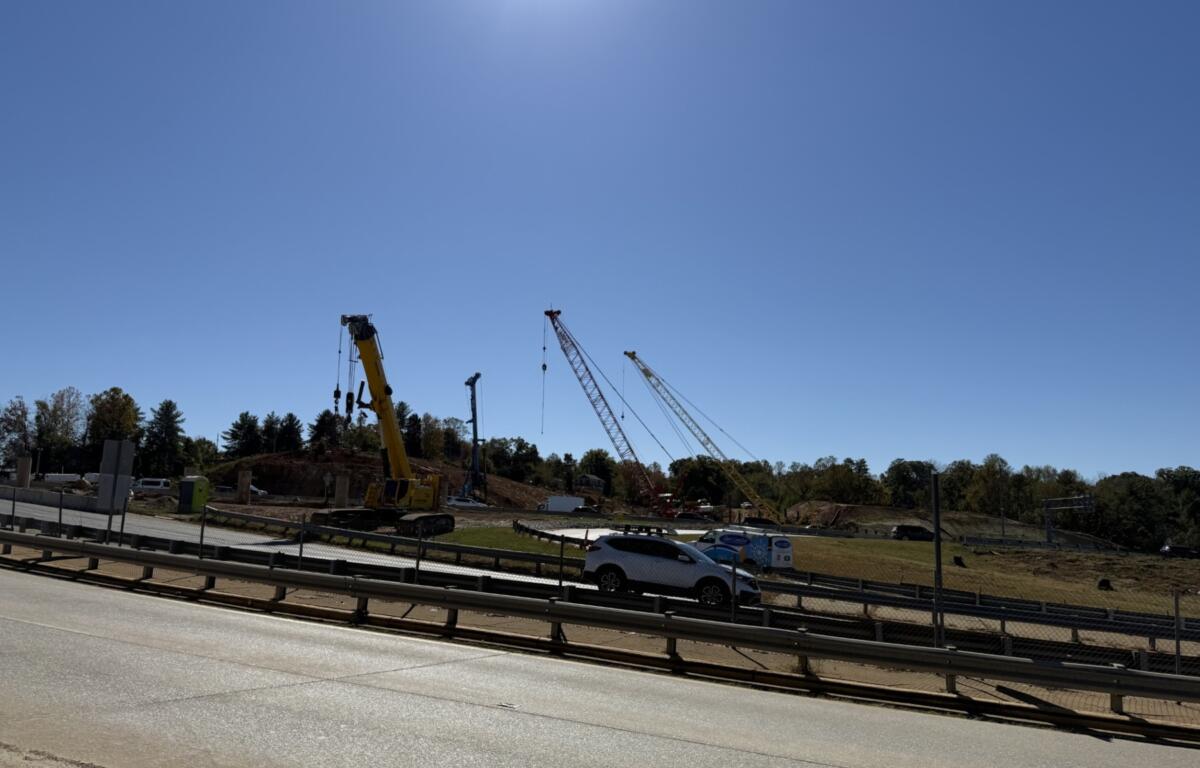 Cranes and heavy equipment stand at an I-26 Connector construction site near Patton Avenue and Interstate 240 in Asheville. Overnight lane closures are scheduled this week as work continues on the highway project.