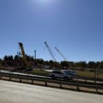 Cranes and heavy equipment stand at an I-26 Connector construction site near Patton Avenue and Interstate 240 in Asheville. Overnight lane closures are scheduled this week as work continues on the highway project.