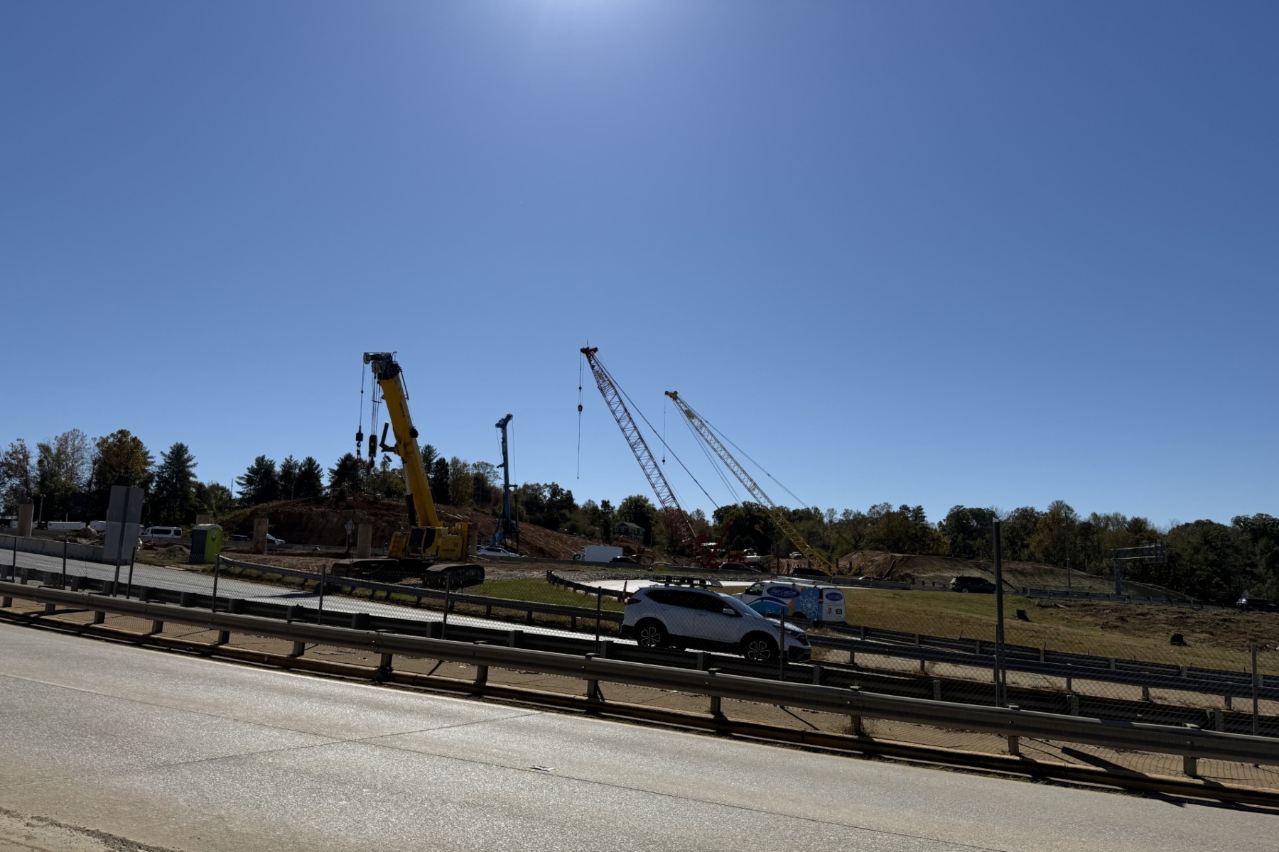 Cranes and heavy equipment stand at an I-26 Connector construction site near Patton Avenue and Interstate 240 in Asheville. Overnight lane closures are scheduled this week as work continues on the highway project.