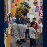 Ted E. Tourist, the Asheville Tourists’ mascot, surprises kindergartners at Johnston Elementary School during the school’s annual Bear Breakfast on Friday, Oct. 2, 2026.