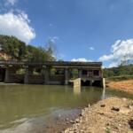 Lake Craig Dam spans the Swannanoa River in Asheville. Hurricane Helene partially washed out the century-old dam, creating an opening that has allowed fish to reach upstream habitat that had been blocked for more than 100 years.