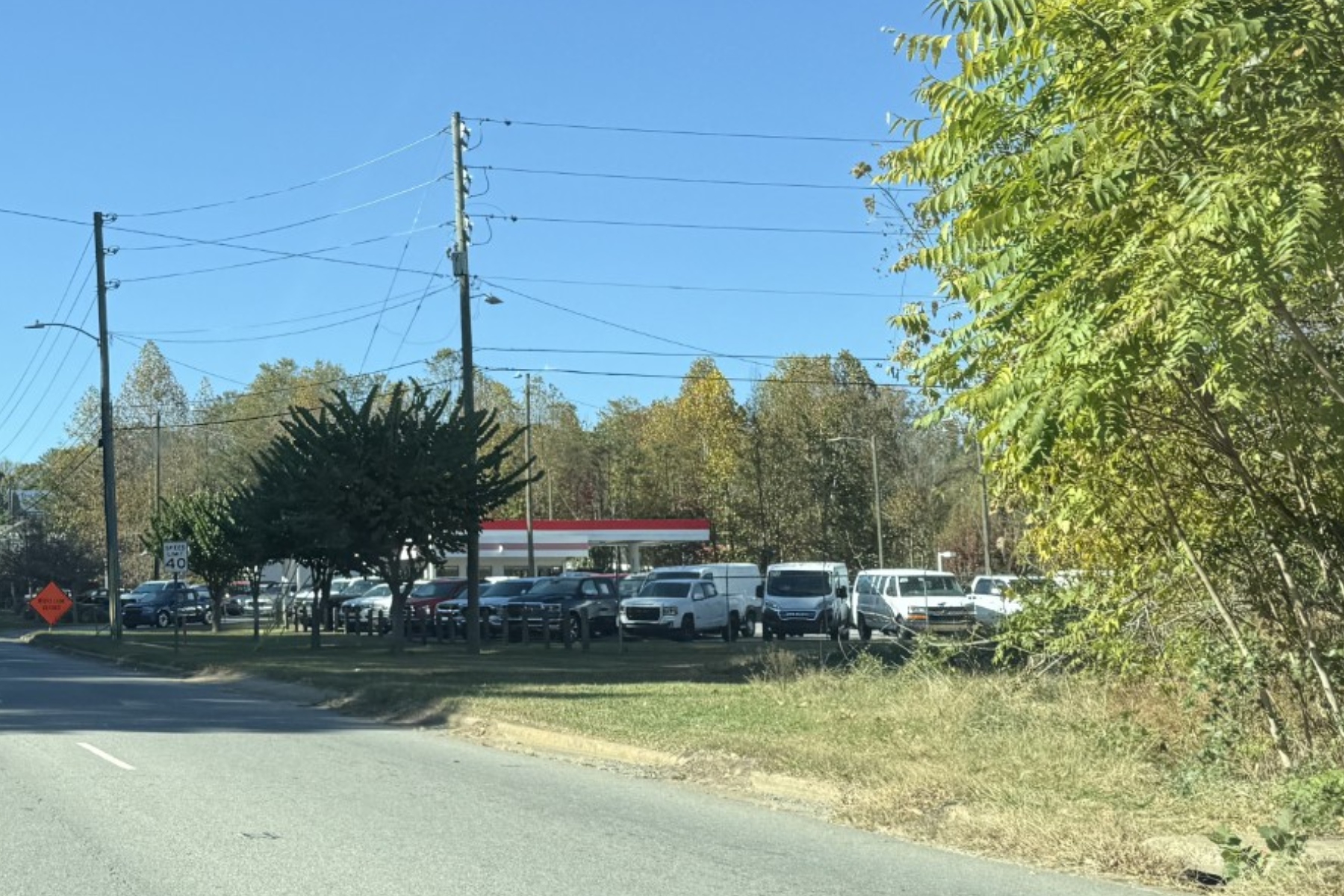 A stretch of Patton Avenue near Old Haywood Road in Asheville has no sidewalk along the roadside. A proposed transportation project would fill sidewalk gaps between the western end of Old Haywood Road and Johnston Boulevard.