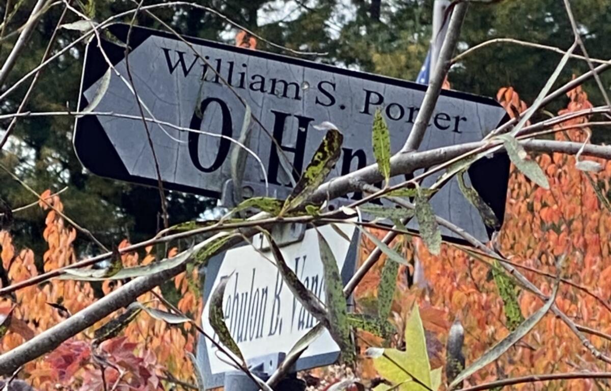 A marker points visitors to the grave of William Sydney Porter, better known as O. Henry, at Riverside Cemetery in Asheville. The celebrated short-story writer spent time in Asheville before his death in New York City in 1910 and was buried at Riverside Cemetery.
