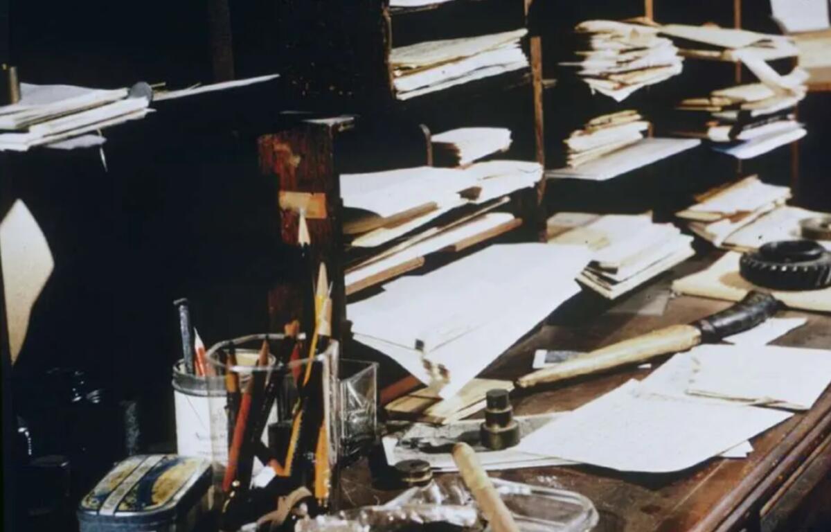 Papers, pencils and writing materials cover the desk of poet and author Carl Sandburg at Connemara, his home in Flat Rock. Sandburg moved to the Henderson County farm in 1945 and continued writing there until his death in 1967. The property is now the Carl Sandburg Home National Historic Site. (Public domain
