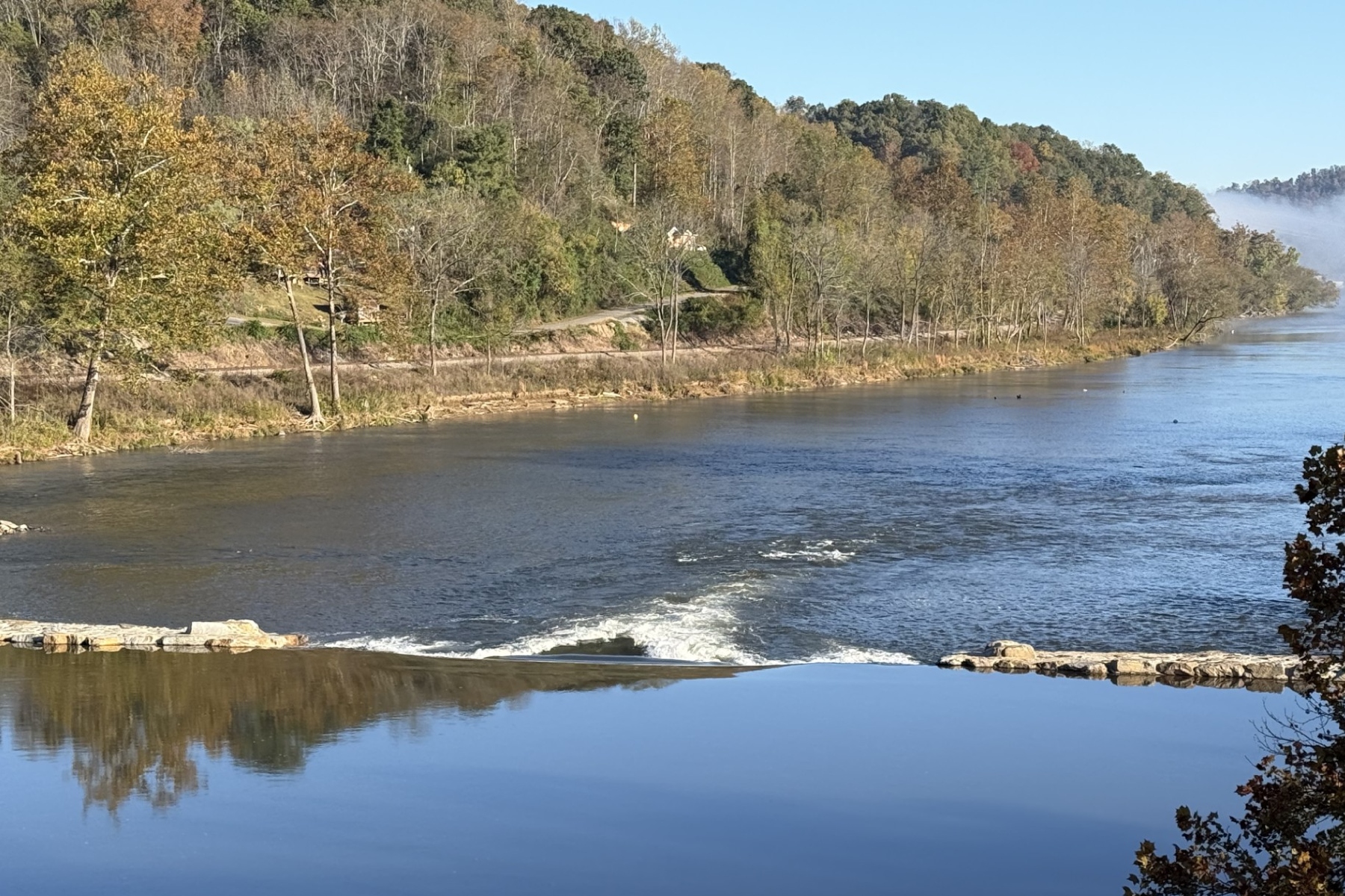 Taylor's Wave creates a standing wave on the French Broad River in Woodfin. The $4.8 million whitewater attraction opened in October 2026 after years of planning and construction delays caused by Tropical Storm Helene.