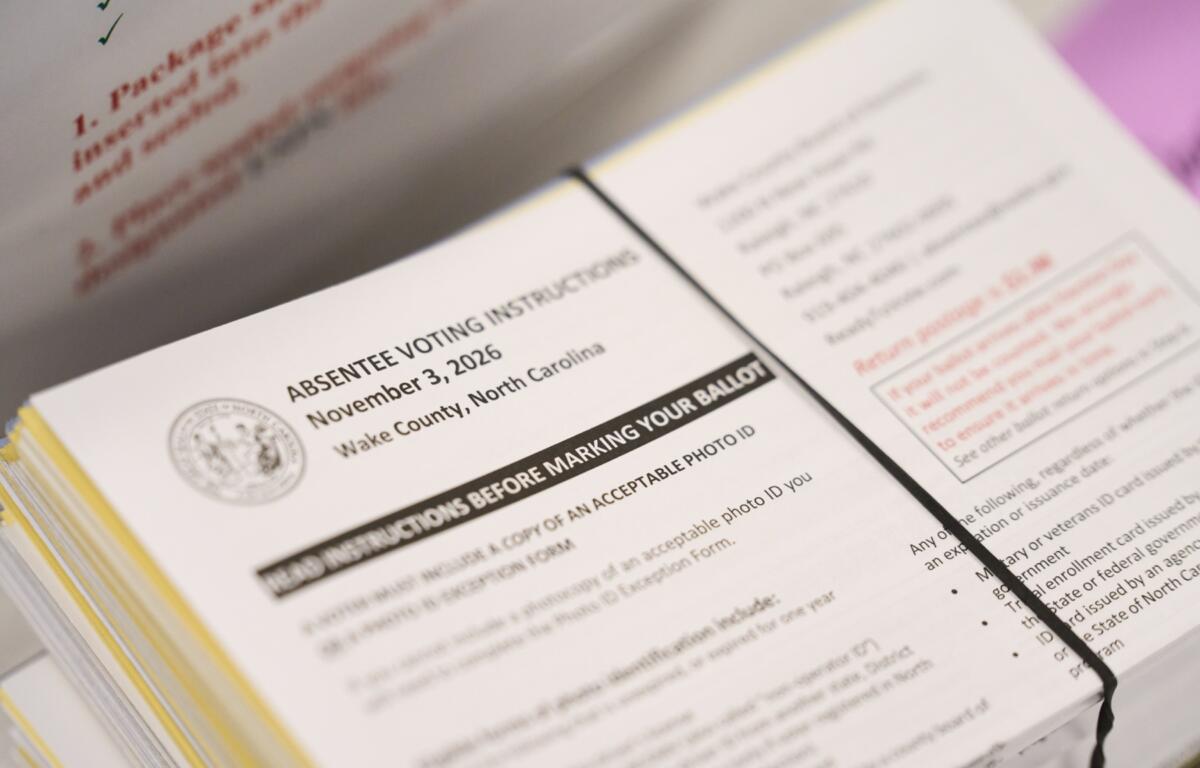 Absentee voting instructions for mail-in ballots are seen at the Wake County Board of Elections on Thursday, Sept. 3, 2026, in Raleigh, N.C. (AP Photo/Matt Ramey)