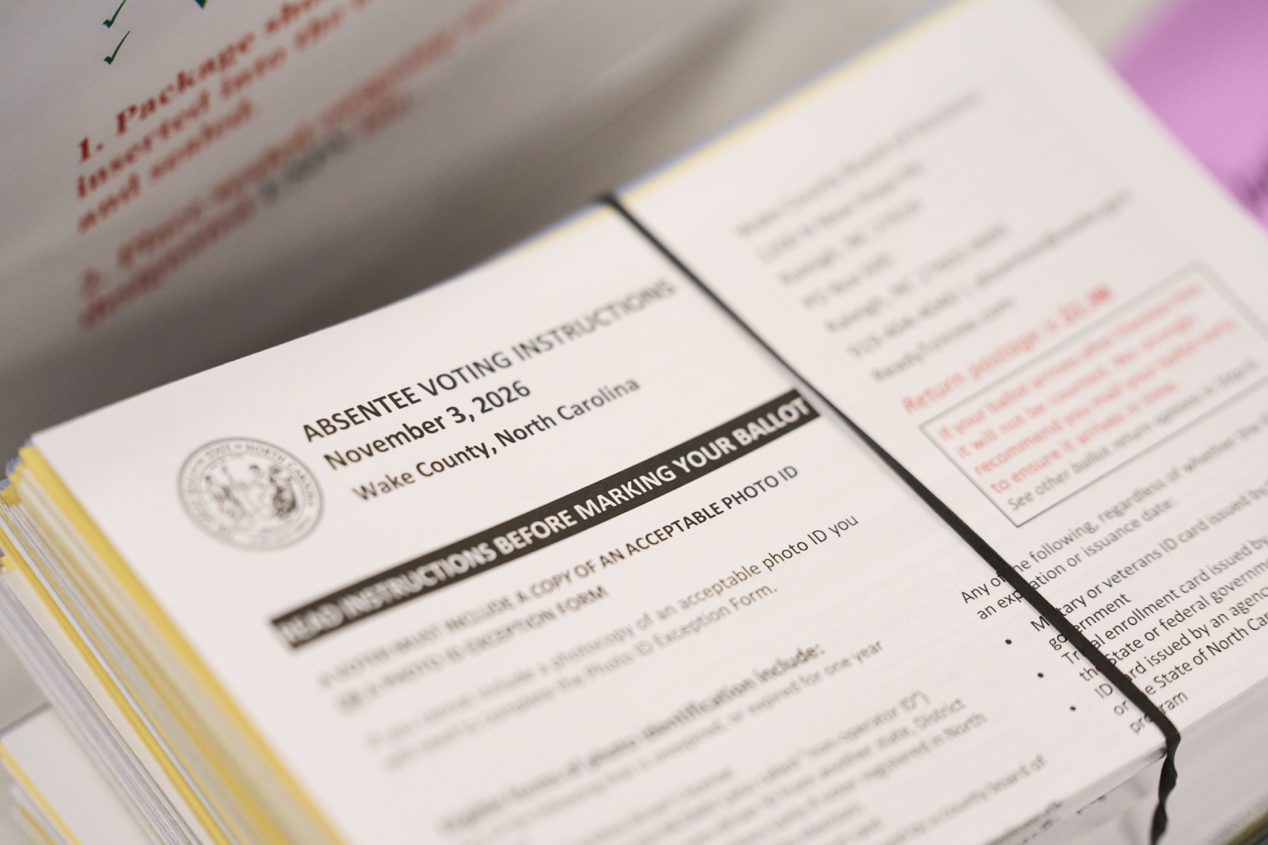 Absentee voting instructions for mail-in ballots are seen at the Wake County Board of Elections on Thursday, Sept. 3, 2026, in Raleigh, N.C. (AP Photo/Matt Ramey)