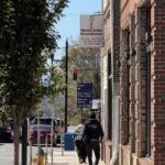 Pedestrians walk past Western Carolina Rescue Ministries in downtown Asheville.